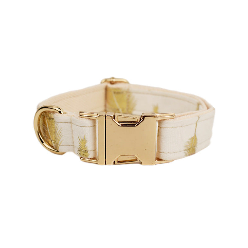 A set of dog pet accessories including a collar, leash, bow, flower decoration, and a vest, all in green with a gold leaf pattern.