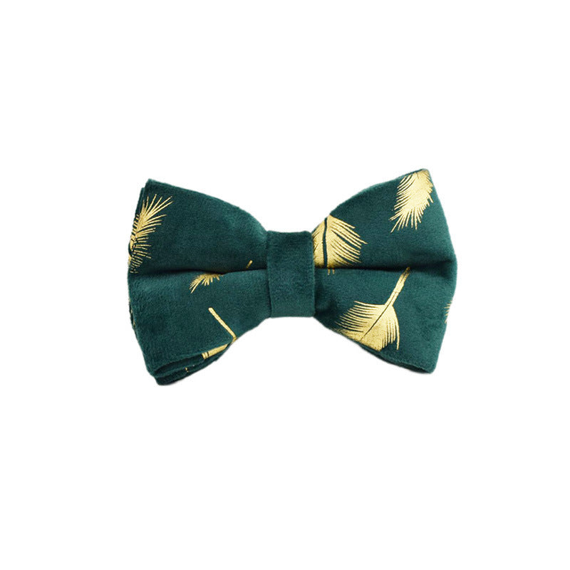 A set of dog pet accessories including a collar, leash, bow, flower decoration, and a vest, all in green with a gold leaf pattern.