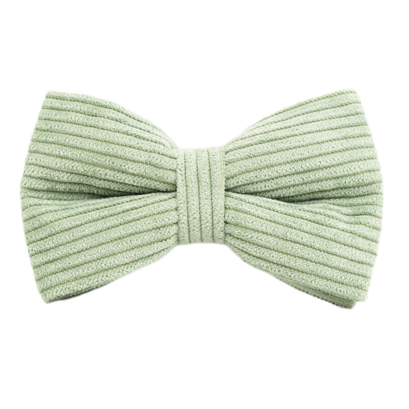 A set of dog pet accessories including a collar, leash, bow, flower decoration, and a vest, all in green with a gold leaf pattern.