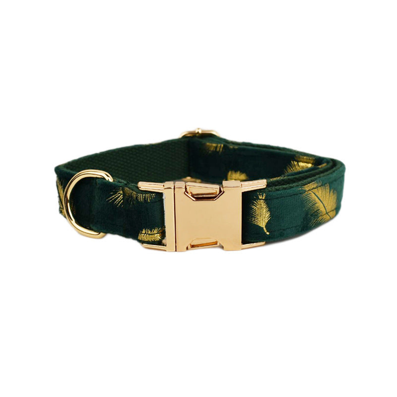 A set of dog pet accessories including a collar, leash, bow, flower decoration, and a vest, all in green with a gold leaf pattern.
