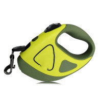 A hand holding a retractable dog leash with an LED shining button, predominantly black and white in color.
