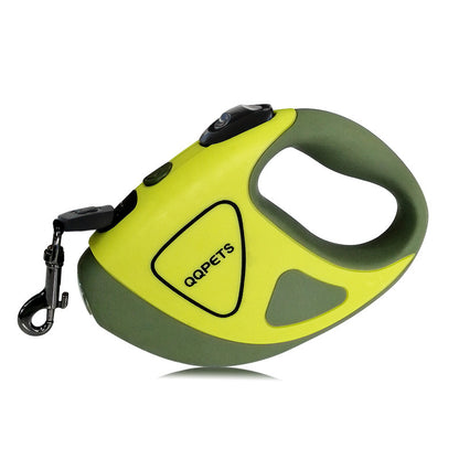 A hand holding a retractable dog leash with an LED shining button, predominantly black and white in color.