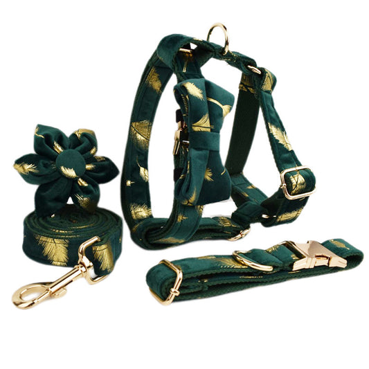 A set of dog pet accessories including a collar, leash, bow, flower decoration, and a vest, all in green with a gold leaf pattern.