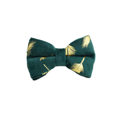 A set of dog pet accessories including a collar, leash, bow, flower decoration, and a vest, all in green with a gold leaf pattern.